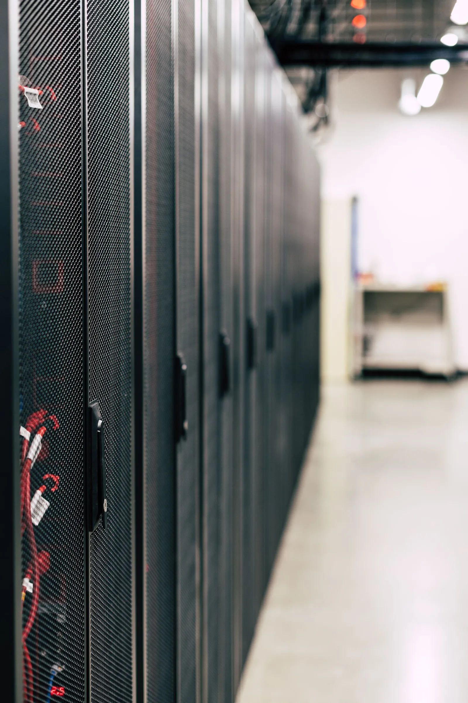Server racks in a data centre; illustrative stock, not an ITQAN facility. Server racks in a data centre; illustrative stock, not an ITQAN facility.